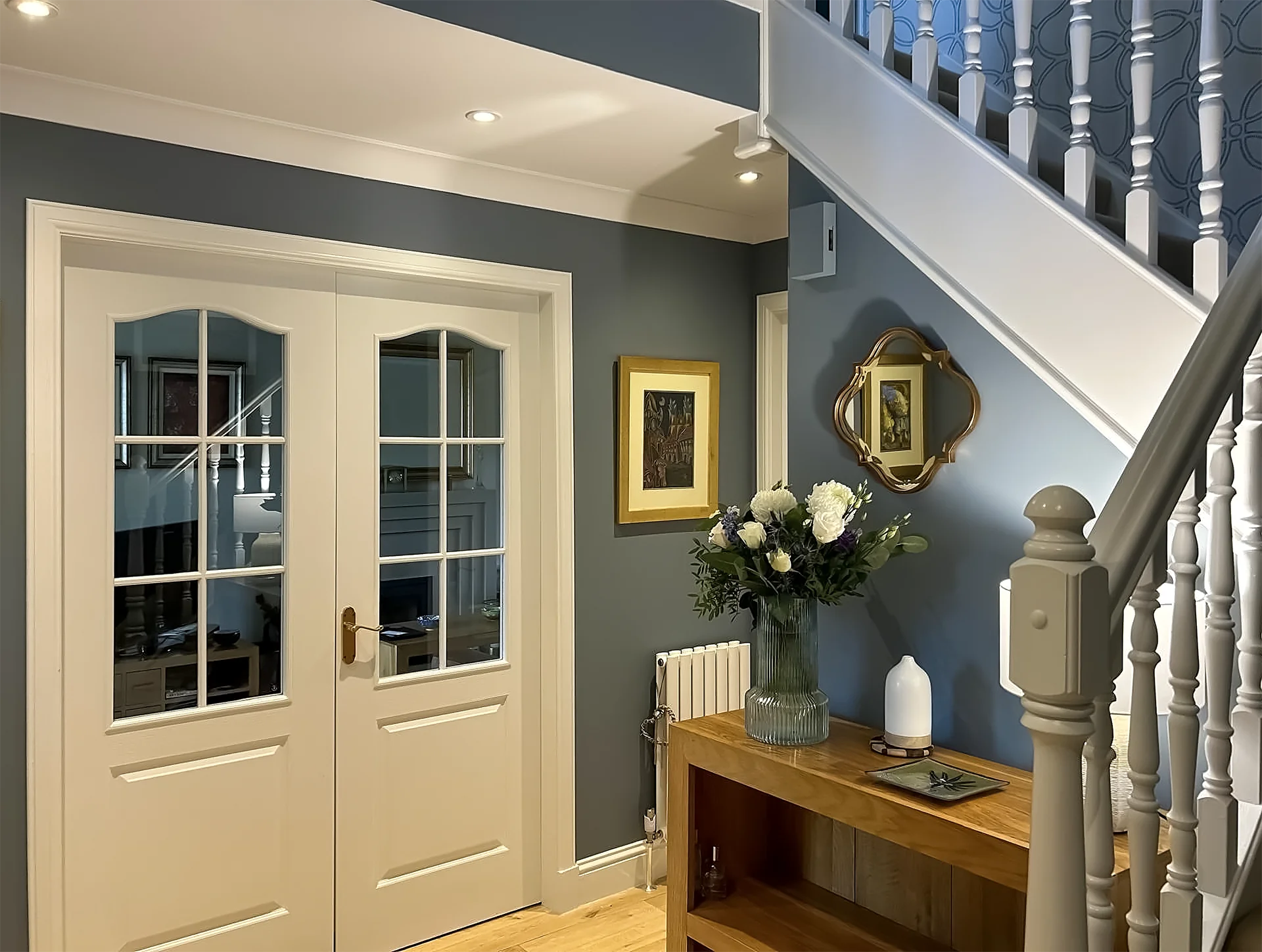 Hallway with glass-panel double doors